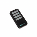 A black PureFlow QT7 remote control with gray buttons and light blue text, shown on a clean white background. 