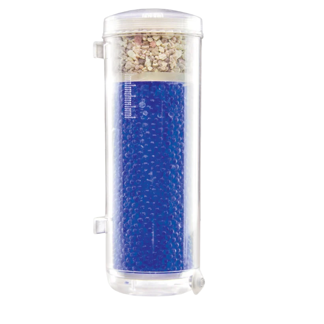 A cylindrical water filter cartridge with a clear plastic body, filled with bright blue beads in the lower section and a top section containing light-colored gravel. It is shown against a plain white background.